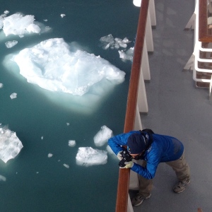 Fellow teacher Enrique snaps a picture of walrus in their icy environment from the ship's deck.